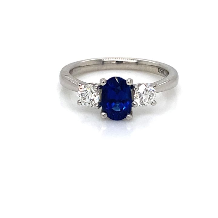 Platinum Oval Sapphire & Round Brilliant Cut Diamond RIng